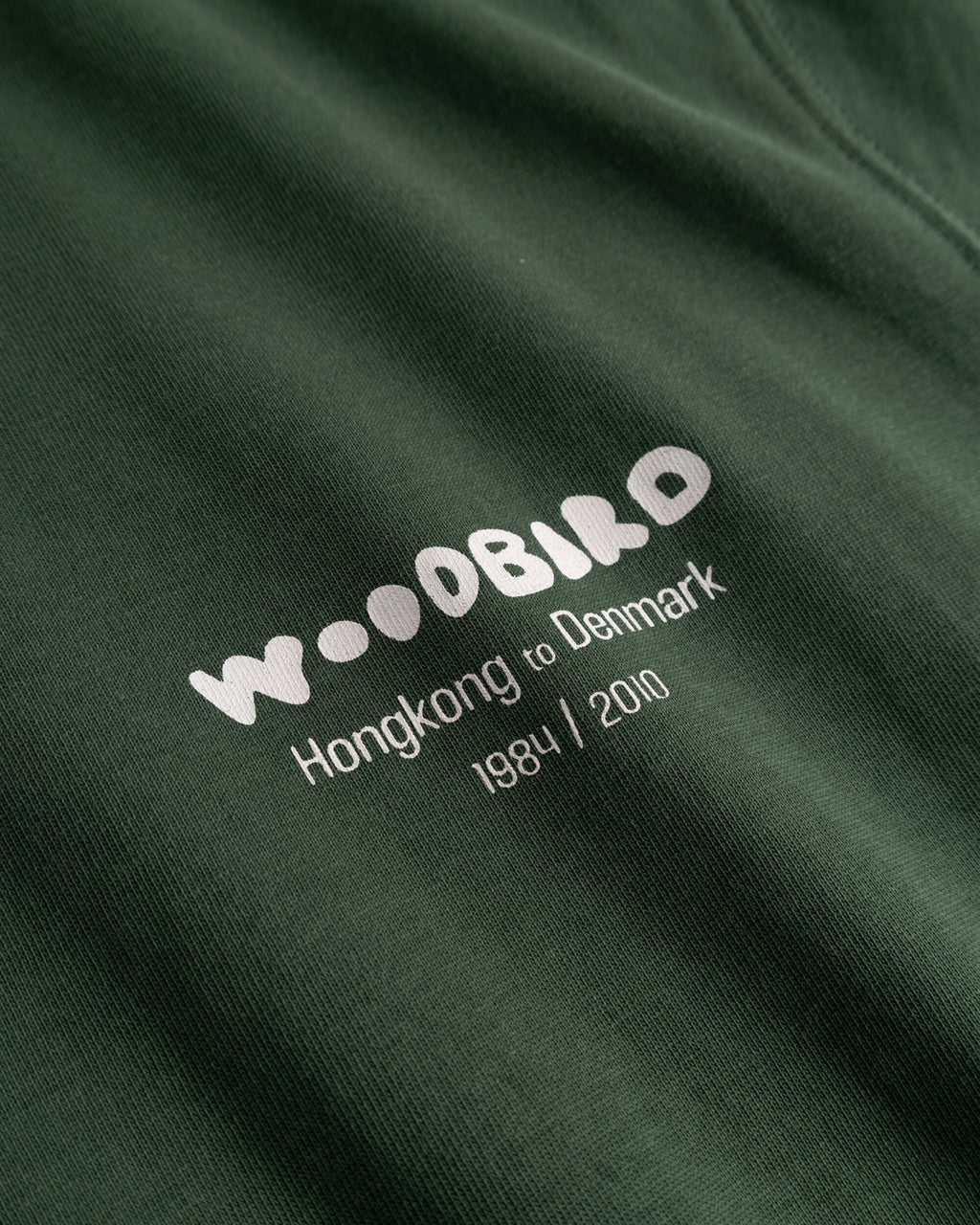 Merklogo van Woodbird Baine Wok Tee
