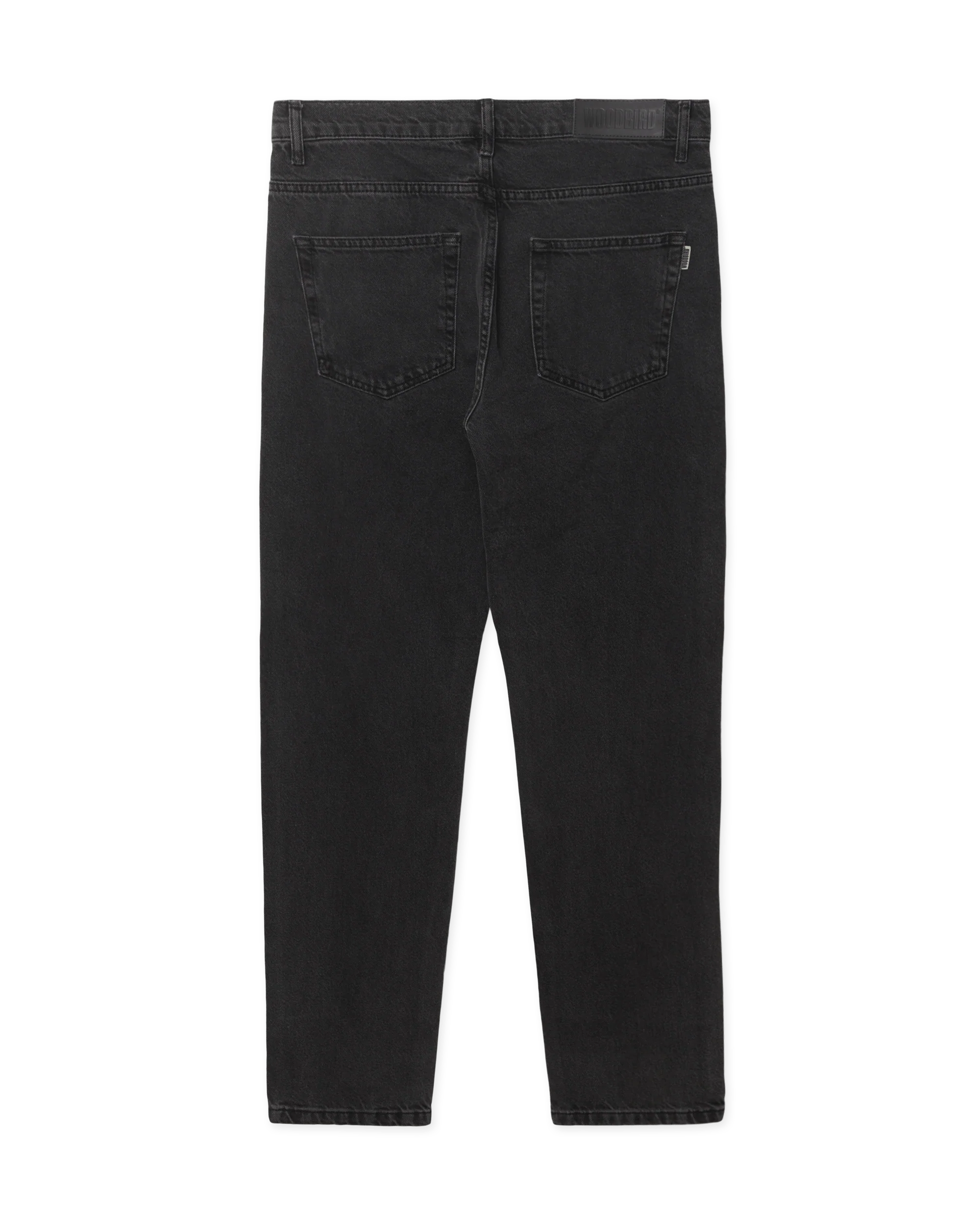 Woodbird WBDoc Crow Jeans zwart, achterkant van de tapered fit denim met subtiele vervaging en ritssluiting.